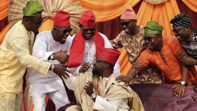 Cast members dressed in traditional attire perform in a scene during the making of ‘Dazzling Mirage’, directed by Tunde Kelani, at a film location in Lagos.