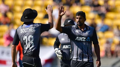 New Zealand's Ish Sodhi, right, celebrates with Tim Southee after taking the wicket of England's Sam Billings during the Twenty20 match in Wellington. AFP