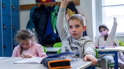 Schoolchildren who fled Ukraine attend a class with children in Vienna, Austria. Unicef says 2.8 million displaced children were in Ukraine and another two million were in other countries. Photo: Reuters