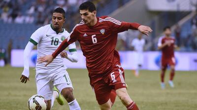 Saudi Arabia’s Salem Al Dawsari, left, fights for the ball with UAE’s Mohanad Salem. Fayez Nureldine / AFP