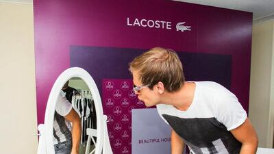DJ Armin van Buuren tries on sunglasses. Courtesy Lumin