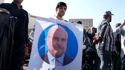 A supporter of Mohammad Bagher Qalibaf during a campaign meeting in Tehran on Saturday. AP