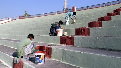 Ground staff prepare the stands at Rawalpindi Cricket Stadium. EPA