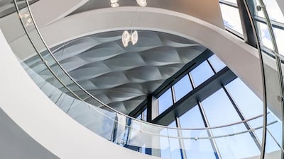 Curvilinear details include flowing lines and curved staircases.