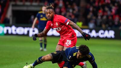 Reiss Nelson, below, vies for the ball with Samuel Bastien of Liege during their Europa League match between in Belgium. EPA