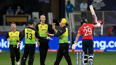 Australian players celebrate after the dismissal of England's Dawid Malan. AFP