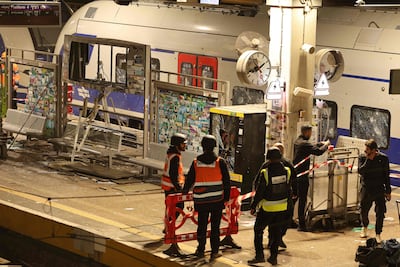 Israeli security forces and rescue workers gather at a train station that was hit by shrapnel after an Iranian strike in Tel Aviv, on March 18. AFP