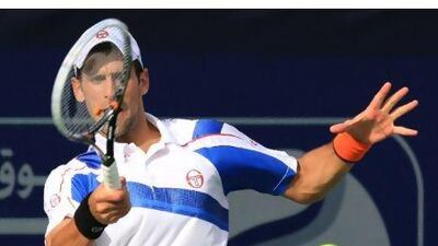 Novak Djokovic unleashes a forehand return against Tomas Berdych yesterday.