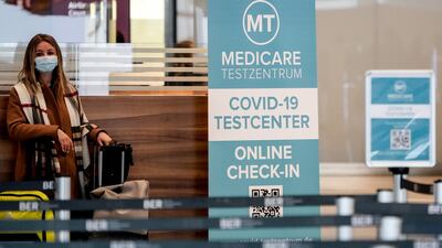 A passenger at a coronavirus test station at Terminal 1 of the Berlin Brandenburg Airport in Germany. Global passenger traffic is expected to decline 47.5 per cent this year in wake of the Covid-19 crisis. EPA