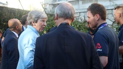 British prime minister Theresa May chats with England captain Eoin Morgan in the garden of 10 Downing Street. AFP
