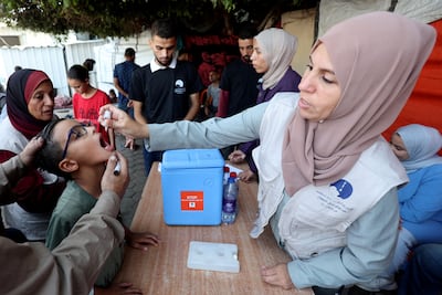A Palestinian child is vaccinated against polio during a vaccination campaign in Deir Al Balah, Gaza Reuters
