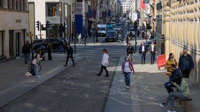 Shoppers and pedestrians pass the Burberry store in central London, UK. Despite restrictions easing in February, consumers stayed away from the shops amid the cost-of-living crunch. Bloomberg
