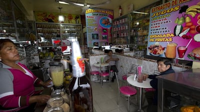 The juice is a greenish colour and Ms Cruz serves it in glasses to her customers.