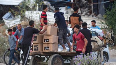 Palestinians have travelled long distances to collect aid from Gaza Humanitarian Foundation food banks. AFP