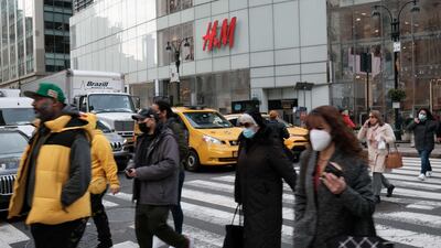 People walk along a main shopping street in Manhattan. The supply chain shortages mean Americans can’t spend like they used to. Getty Images