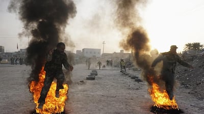 Shi’ite volunteers, who have joined the Iraqi army to fight against militants of the Islamic State take part in field training in Najaf. Ahmad Mousa / Reuters