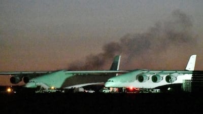Heavy black smoke rises from one of the six engines starting, before the first test flight of the world's largest airplane. Reuters
