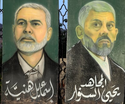 Portraits of late Hamas leaders Ismail Haniyeh, left, and Yahya Sinwar, on a fence in Sanaa, the capital of Yemen that is under the control of the Iran-backed Houthi militia. EPA