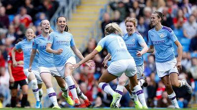 Manchester City's Caroline Weir, centre, celebrates after scoring the winning goal against Manchester United in the Women's Super League at the Etihad Stadium on Sunday. Reuters