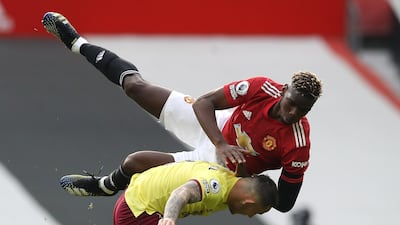 Manchester United's Paul Pogba tangles with Josh Brownhill of Burnley. Reuters