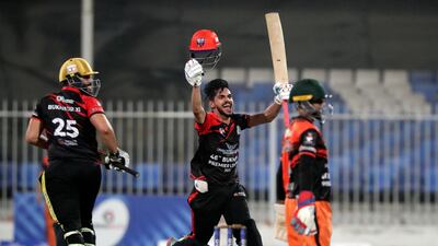 Bukhatir's Khalid Shah celebrates his century in the Bukhatir League semifinal. against Atlas Foundation. Chris Whiteoak / The National