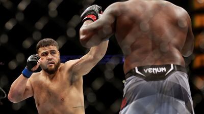 Tai Tuivasa exchanges strikes with Derrick Lewis in their heavyweight fight at UFC 271. Getty Images