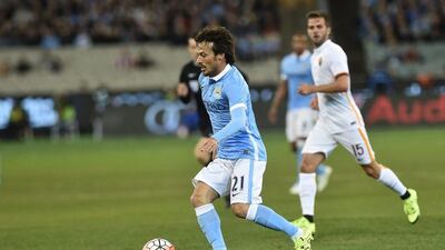 David Silva of Manchester City dribbles against AS Roma on Tuesday during his side's tour match win in Melbourne. Julian Smith / EPA