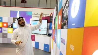 Issam Abdul Rahim Kazim, the chief executive at DTCM, describes the new website at Gitex yesterday. Pawan Singh / The National