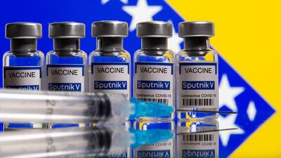 Sputnik V vials displayed in front of the Bosnian flag as the European Union considers using the Russian-made vaccine to combat the rise in Covid-19 infections. Reuters