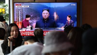 A TV broadcast shows an image of North Korean leader Kim Jong-un at Seoul Railway Station. Getty