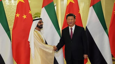 UAE Vice President and Ruler of Dubai Sheikh Mohammed bin Rashid al Maktoum shakes hands with Chinese president Xi Jinping. China is investing into shipping and food projects in Dubai. AFP