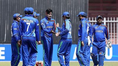 Hamid Hassan, with hair band, and his Afghanistan teammates look unstoppable. Pawan Singh / The National