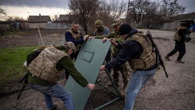Ukrainian guards strengthen their position in the eastern town of Barvinkove. AFP