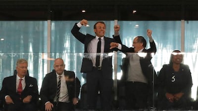 President of France Emmanuel Macron celebrates as King Philippe of Belgium looks on. Reuters