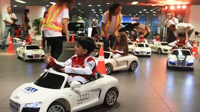 Children get the feel of the road at Al Nabooda Automobiles in an Audi initiative to teach them safe driving. Ravindranath K / The National