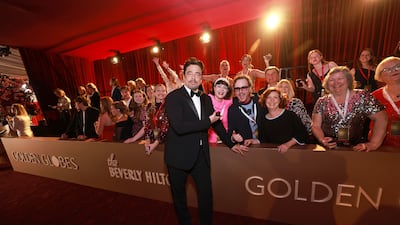 Benicio del Toro with fans on the red carpet. Getty