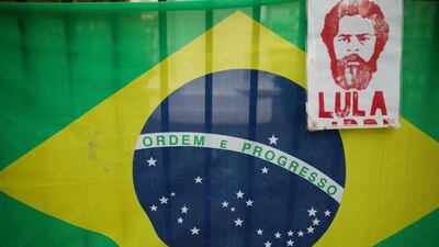 The image of Brazil's jailed former president Luiz Inacio Lula da Silva hangs from a fence at Plaza de Mayo in Buenos Aires, during a protest against the visit of Brazil's President Jair Bolsonaro to Argentina, on June 6, 2019. AP