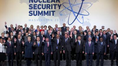 US president Barack Obama and other world leaders wave during a photo session at the Nuclear Security Summit in Washington, on April 1, 2016. Jacquelyn Martin / AP Photo