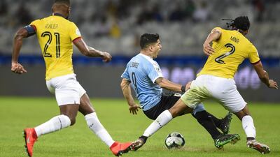 Luis Suarez of Uruguay fights for the ball with Arturo Mina of Ecuador during the Copa America Brazil 2019 group C match between Uruguay and Ecuador at Mineirao Stadium. Getty Images