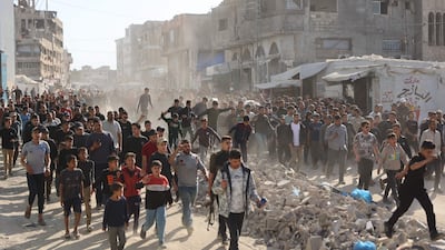 Displaced Palestinians attend the funeral of four people who were killed by an Israeli strike on a vehicle in Gaza city. AFP