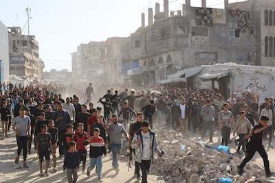 Displaced Palestinians in Gaza city. The Israeli army major is said to have been involved in smuggling mobile phones, cigarettes, car batteries, electric bicycles, laptops, network routers and more into the strip. AFP