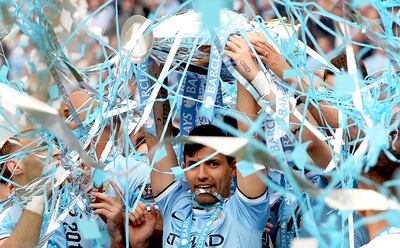 Manchester City's Sergio Aguero lifts the Premier League trophy in 2014. EPA