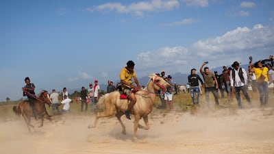 Young men race horses during the annual Rupununi Ranchers Rodeo festival in Lethem, Guyana. AP Photo