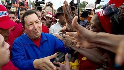 Hugo Chavez, the Venezuelan president, in power for almost 14 years, is vying for a fourth term in office. Juan Barreto / AFP