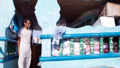A man overseas the loading of his dhow being by Deira's Spice Market. Reem Mohammed / The National
