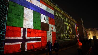Flags of different countries are projected on the walls of Jerusalem's Old City. AFP