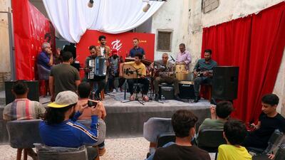 People attend a concert during a rare cultural event in the coastal city of Benghazi in eastern Libya. AFP