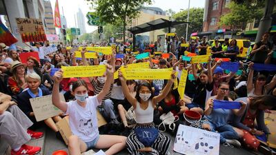 Student activists from School Strike for Climate Australia (SS4C) hold a 'Solidarity Sit-down' protest outside of the office of the Liberal Party of Australia in Sydney. EPA