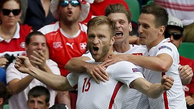 Jakub Blaszczykowski celebrates scoring the opening goal. Robert Ghement / EPA