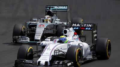 Williams driver Felipe Massa of Brazil is followed by Mercedes driver Lewis Hamilton of Britain during the Hungarian F1 Grand Prix at the Hungaroring circuit, near Budapest, Hungary July 26, 2015. REUTERS/Laszlo Balogh